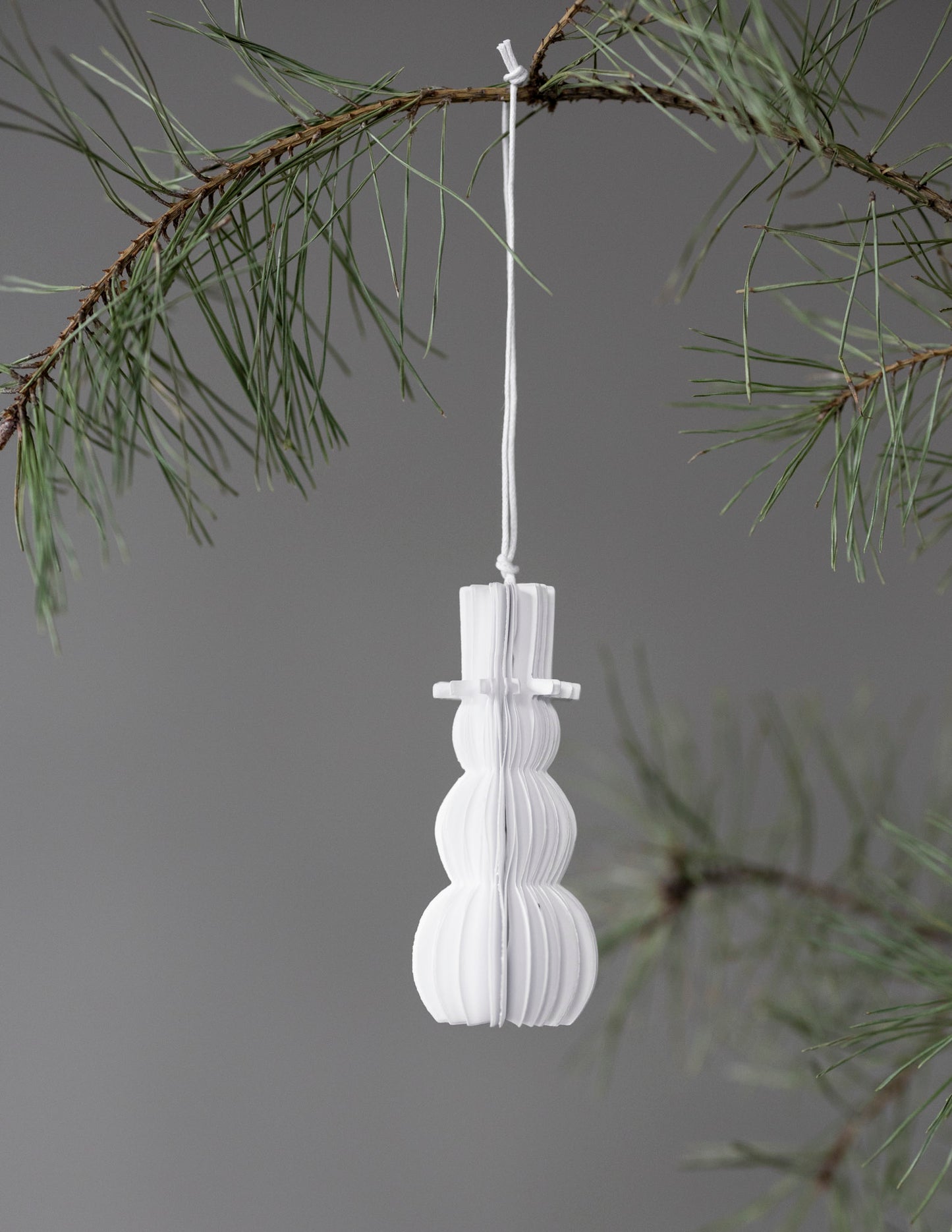 Little white paper honeycome hanging snowman